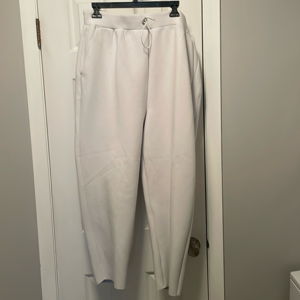 I would say it is a very light light dove white gray very soft material. L